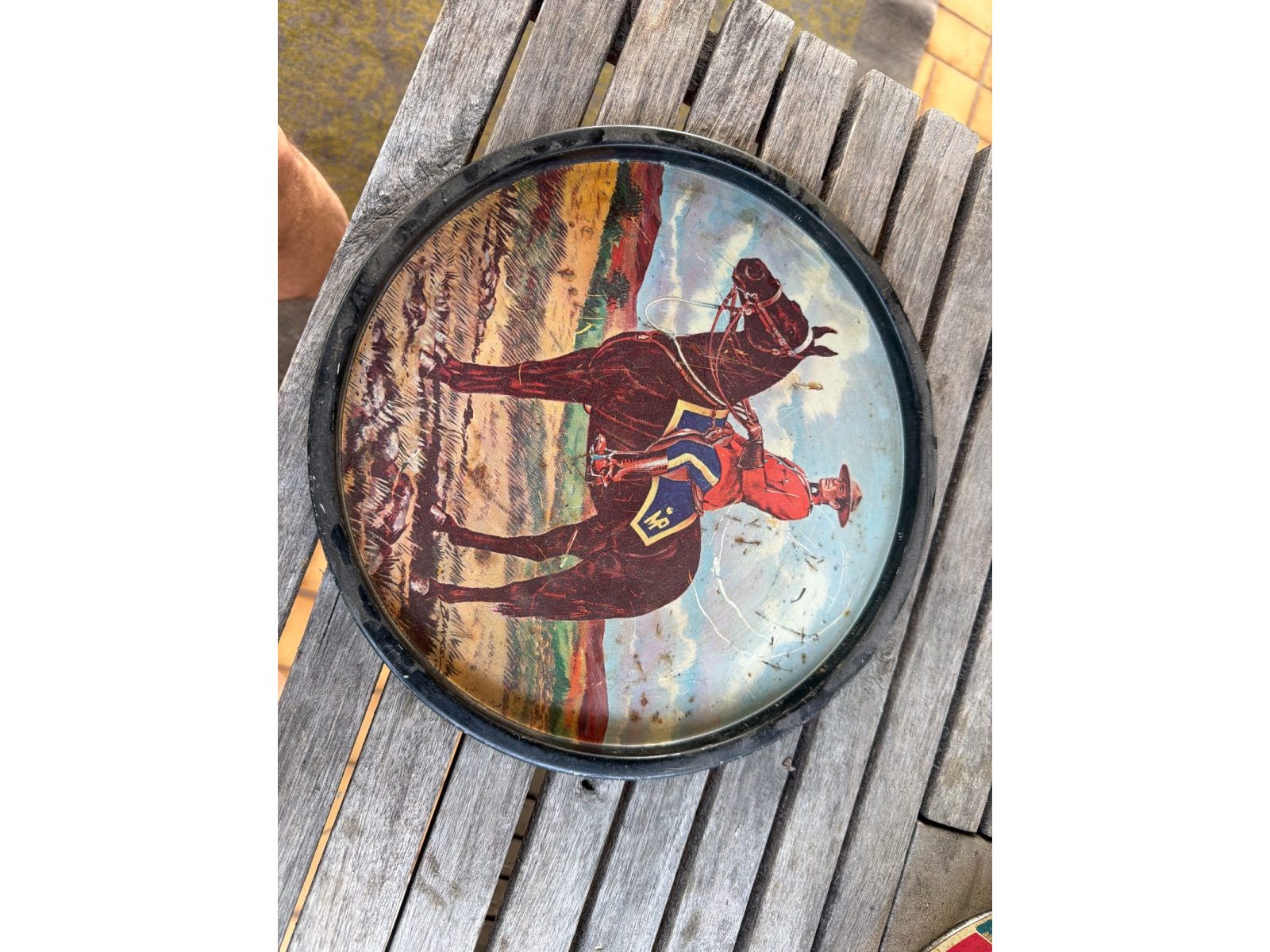 Mid-century lithographed tin lid with RCMP